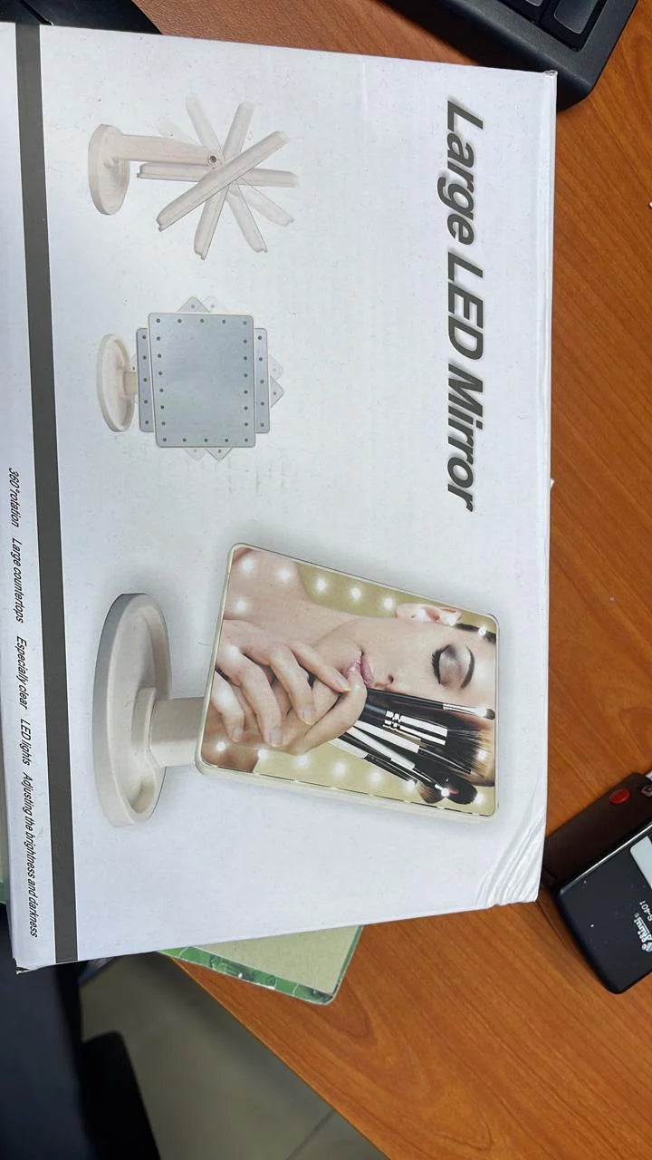 Large LED mirror packaging on a wooden surface