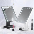 Two vanity mirrors with LED lights on a white background, surrounded by makeup products.