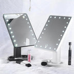 Two vanity mirrors with LED lights on a white background, surrounded by makeup products.
